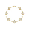 Gold bracelet with diamond-studded clover-shaped links on a white background