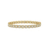 Gold bracelet with diamond accents on a white background