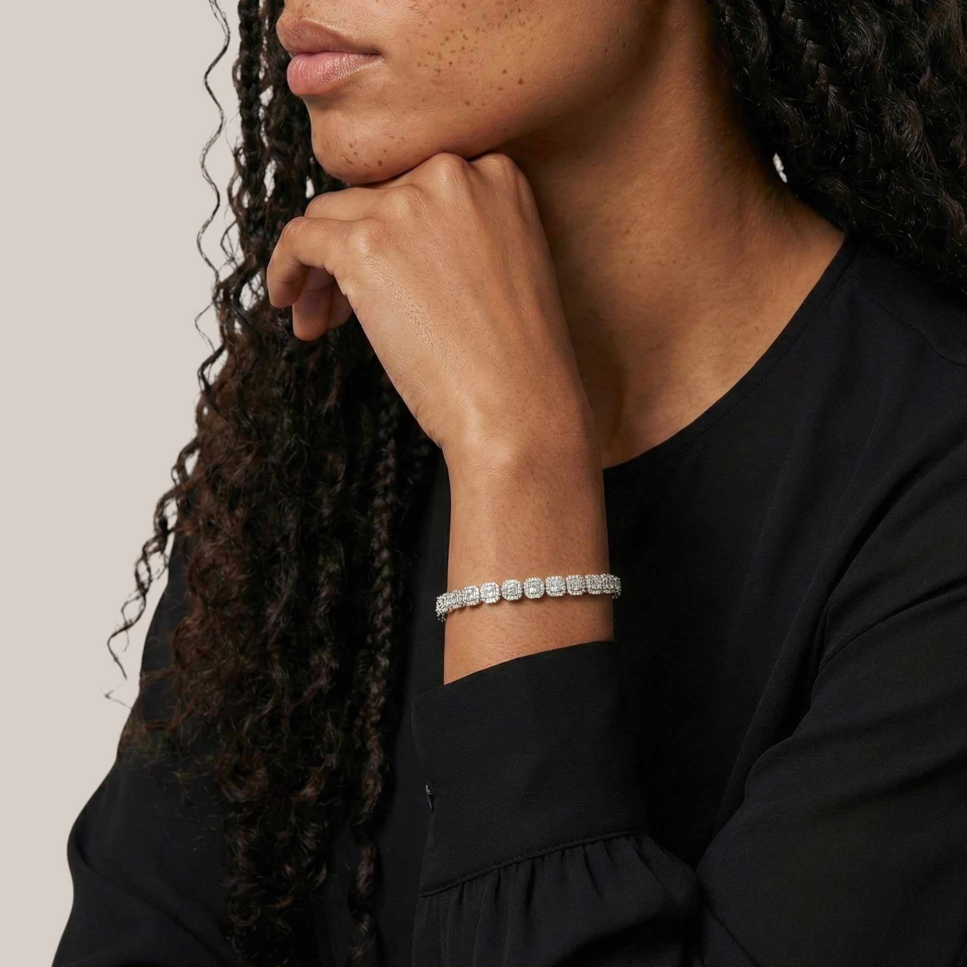 Person wearing a bracelet with a neutral background