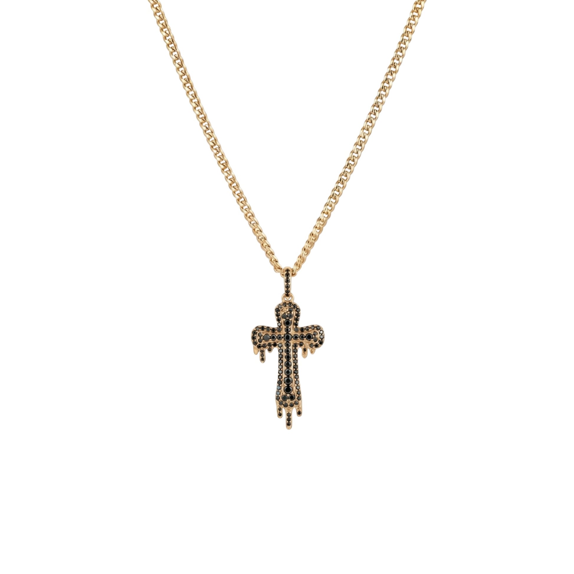 Gold cross necklace with black stones on a white background