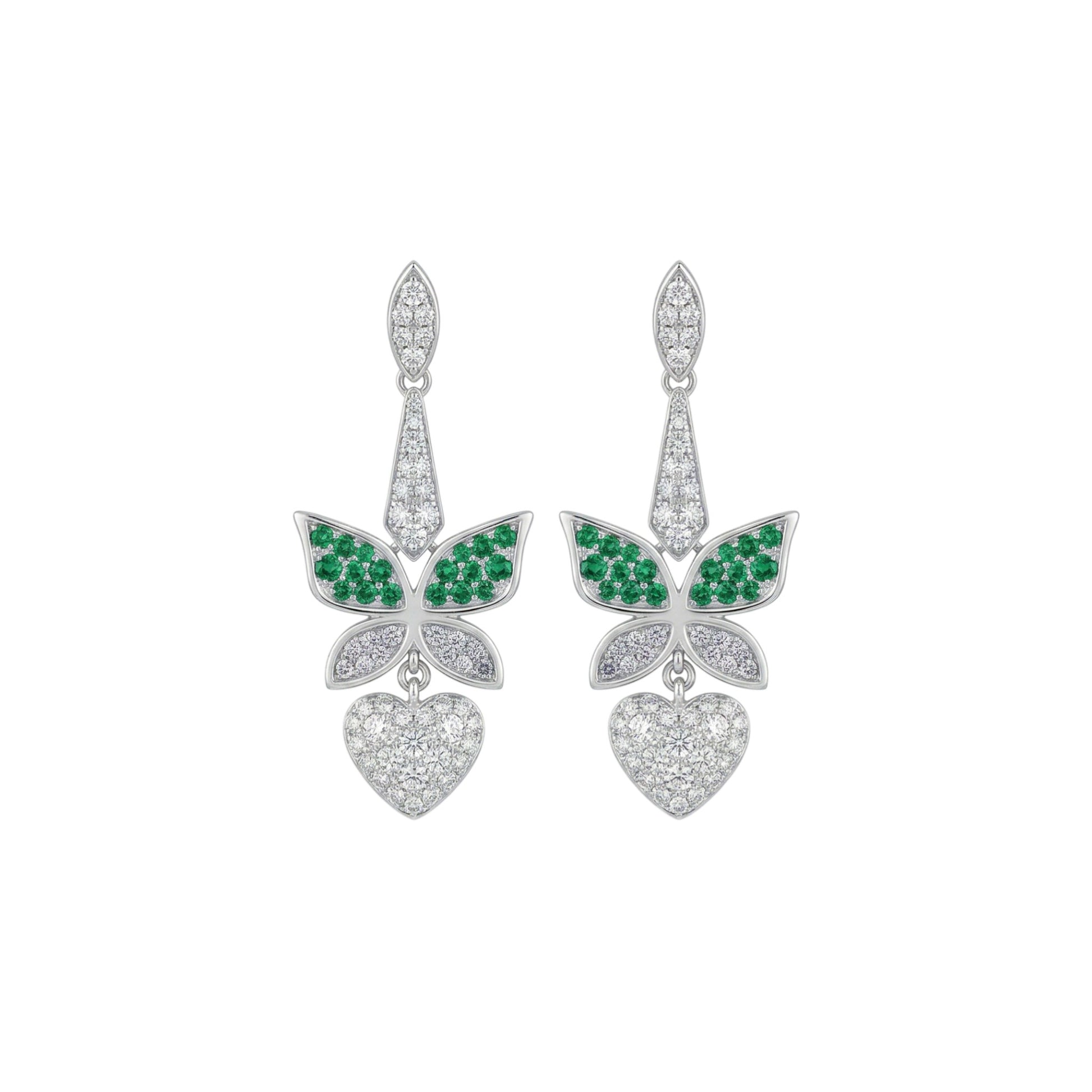Butterfly-shaped earrings with green gemstones and heart details on a white background