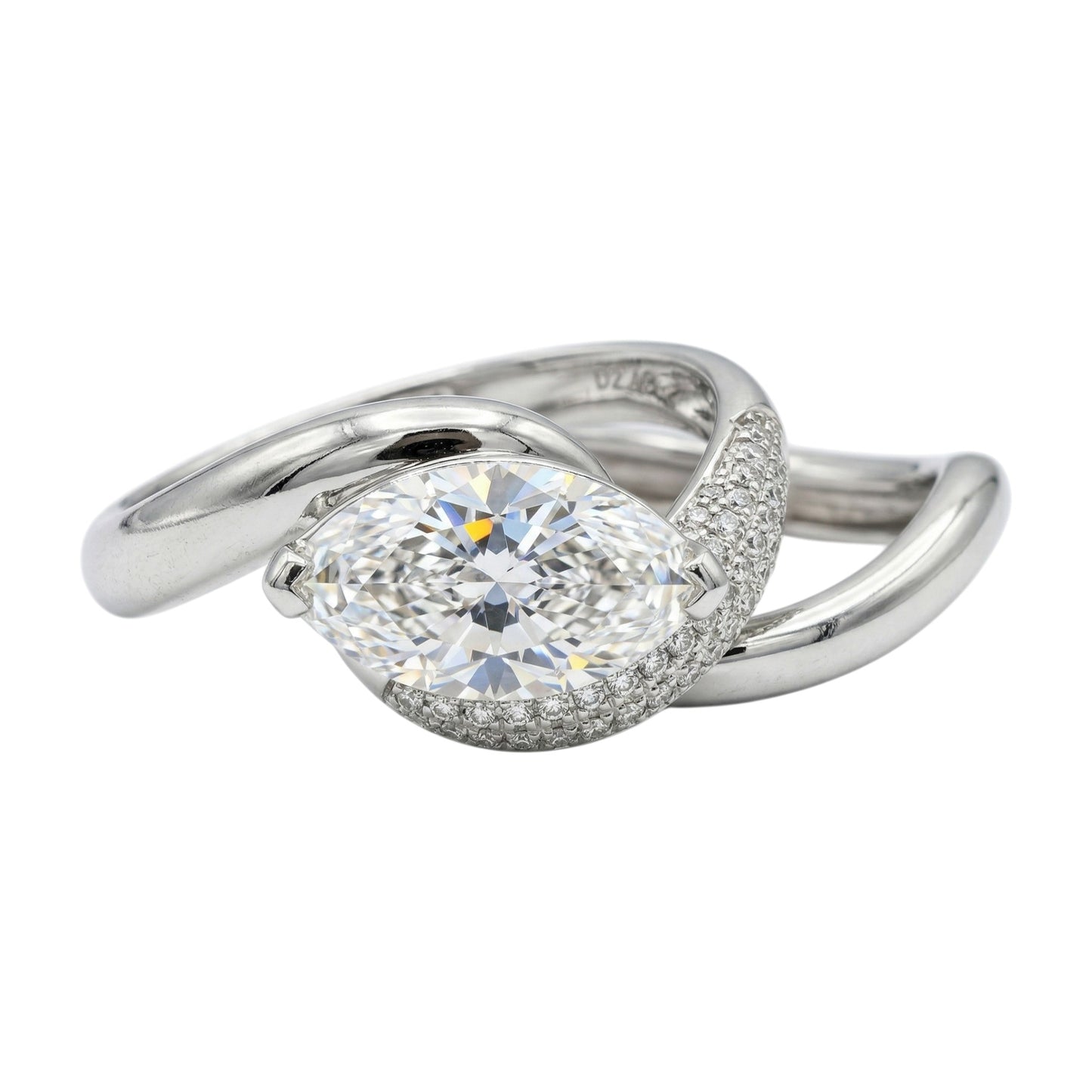 Silver ring with a large diamond on a white background