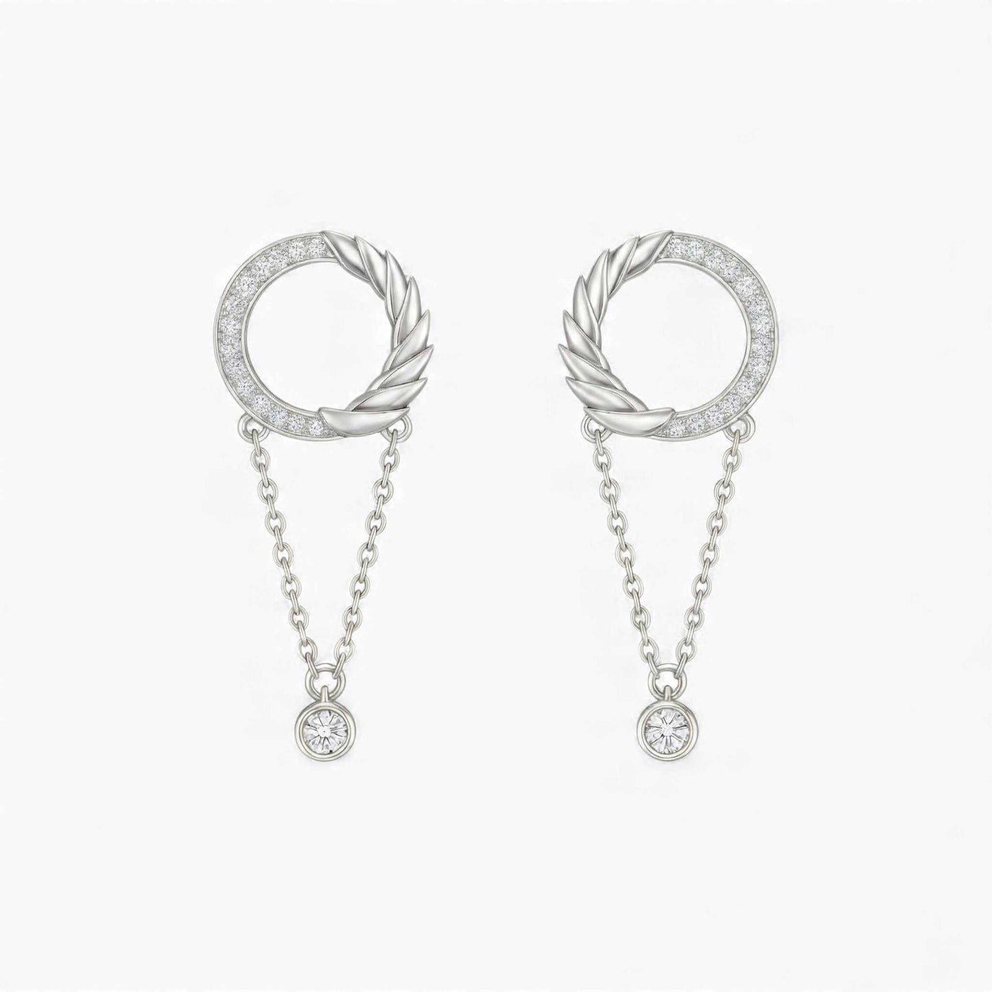 Pair of silver hoop earrings with chain drops on a white background