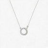 Silver necklace with a circular pendant on a white background