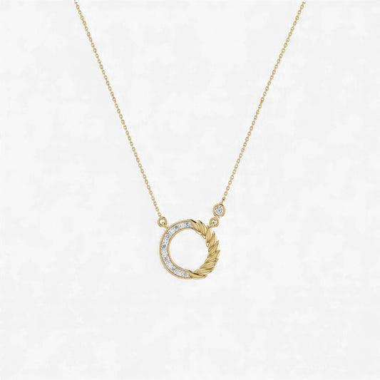 Gold necklace with a unique pendant on a light gray background