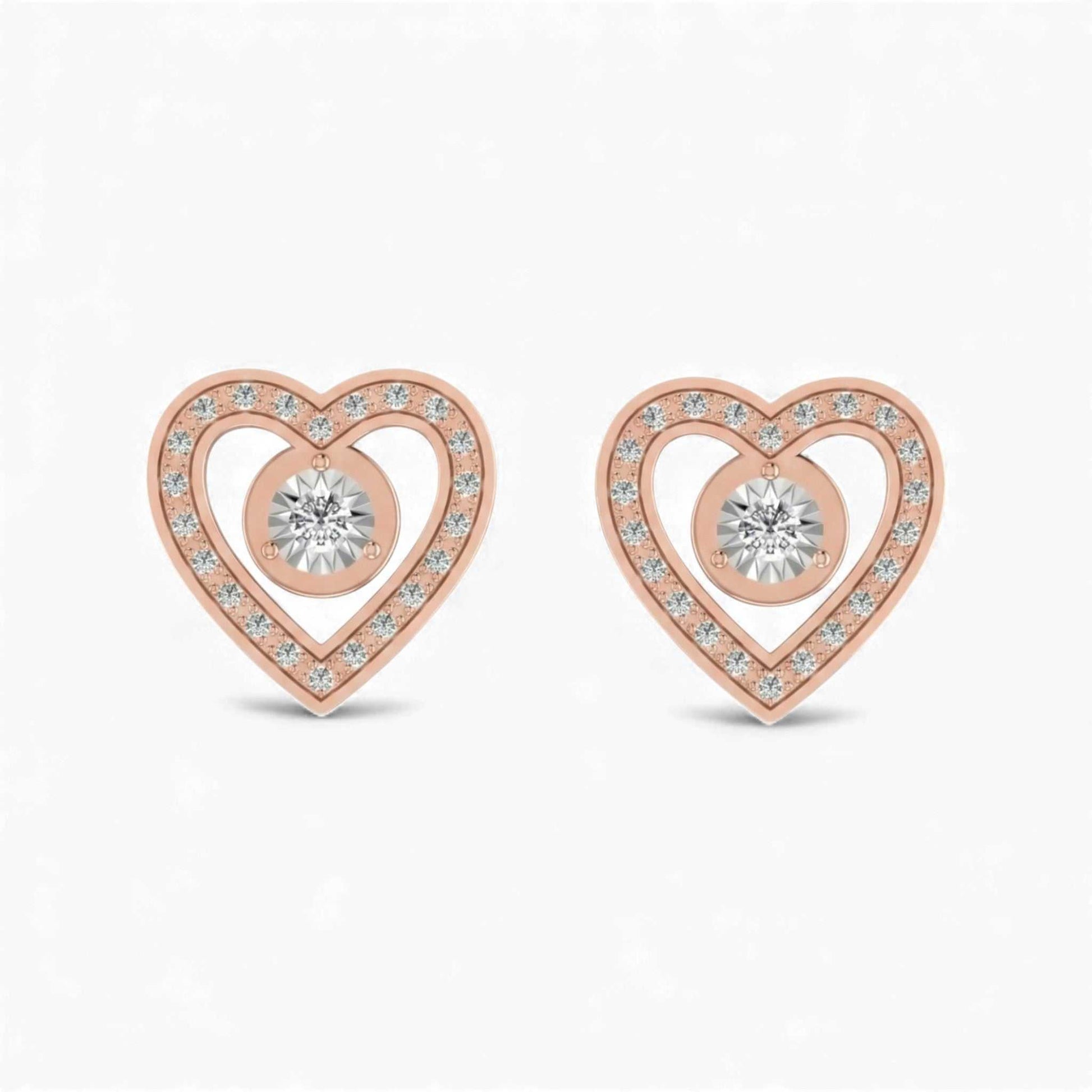 Rose gold heart-shaped earrings with clear gemstones on a white background