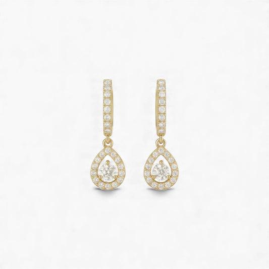 Gold teardrop earrings with clear gemstones on a white background