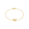 Gold bracelet with a butterfly charm on a white background