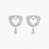 Heart-shaped earrings with feather designs and small crystals on a white background