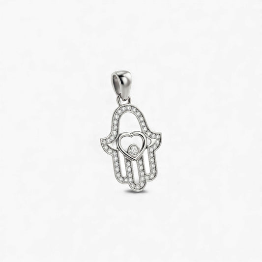 Silver pendant shaped like a hand with a heart in the center on a white background