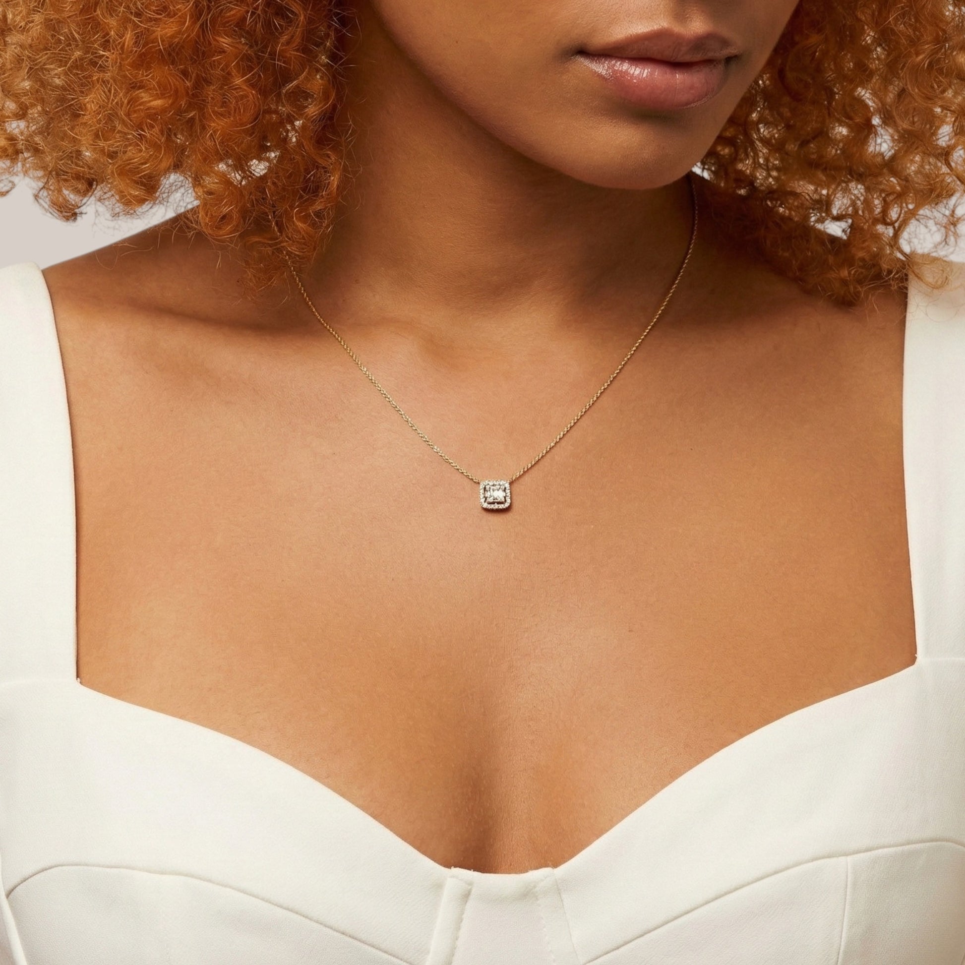 Necklace with a pendant worn by a person