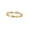 Gold ring with diamond accents on a white background