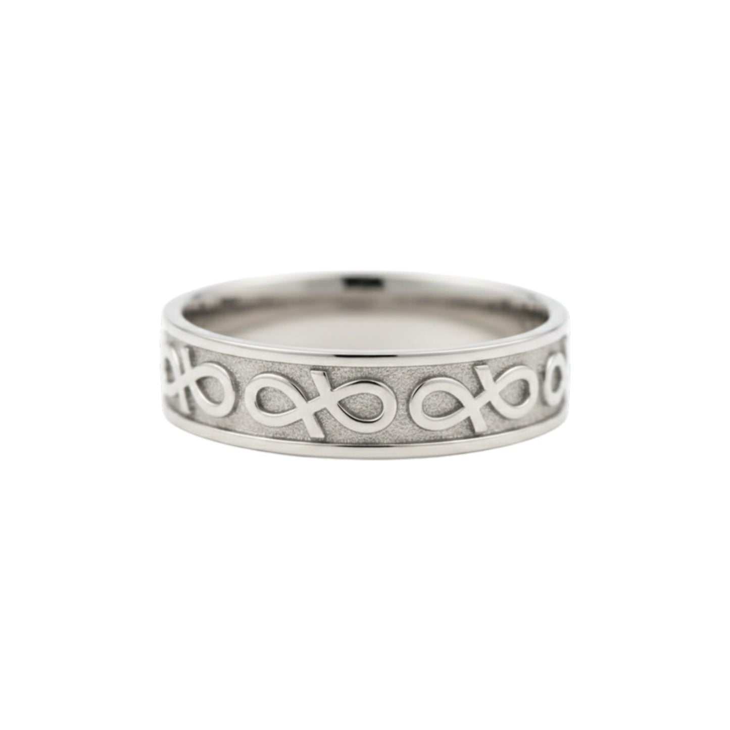 Silver ring with intricate design on a white background