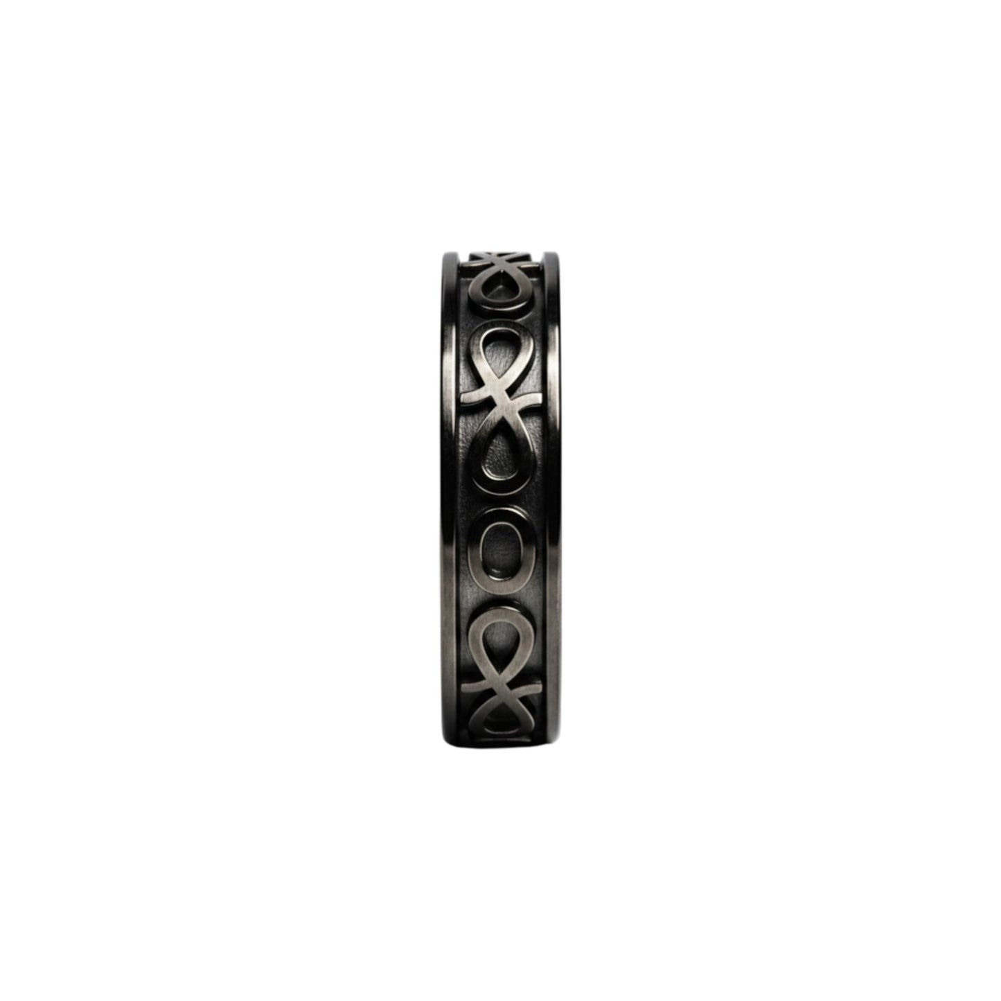 Black ring with intricate design on a white background