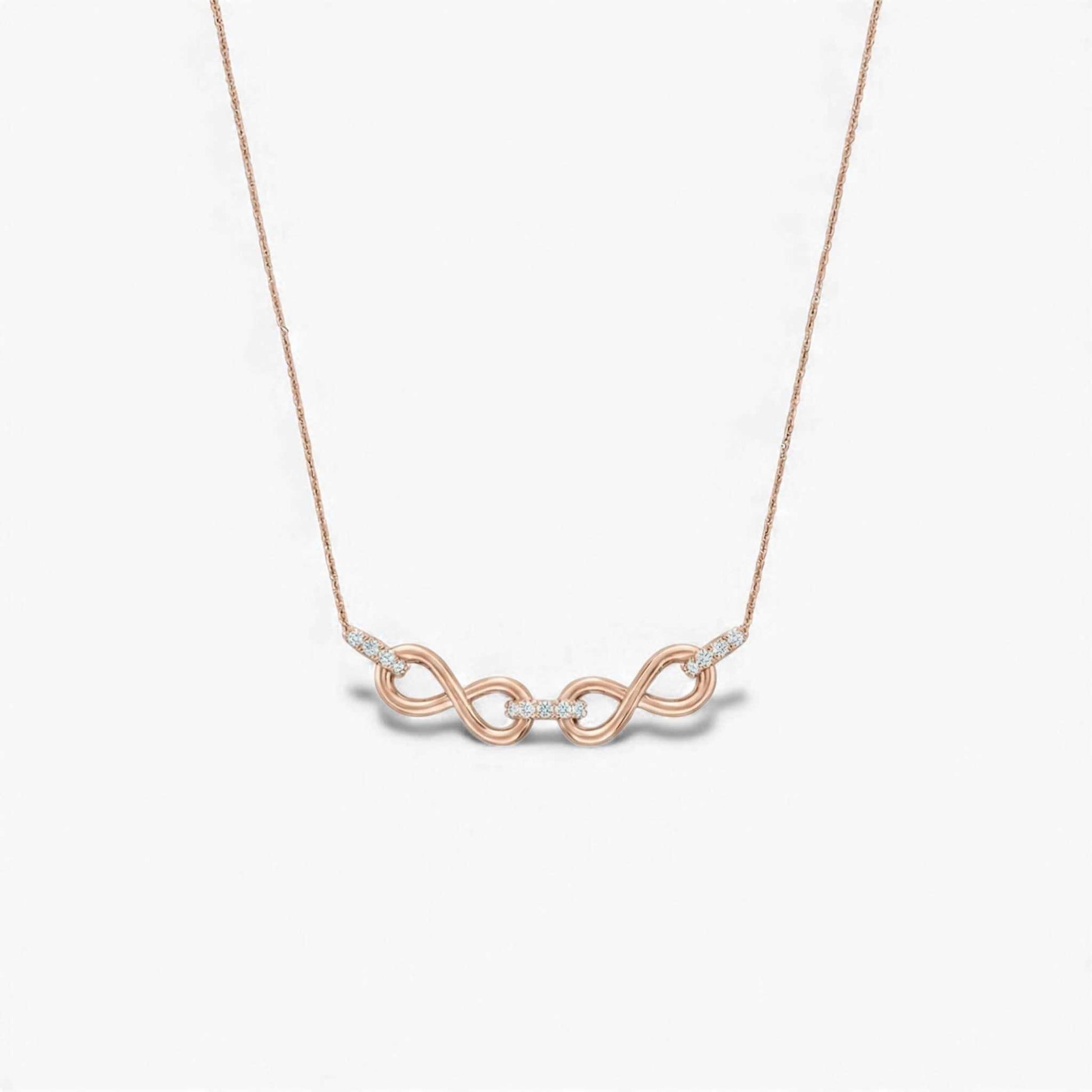 Rose gold necklace with a unique pendant on a light gray background