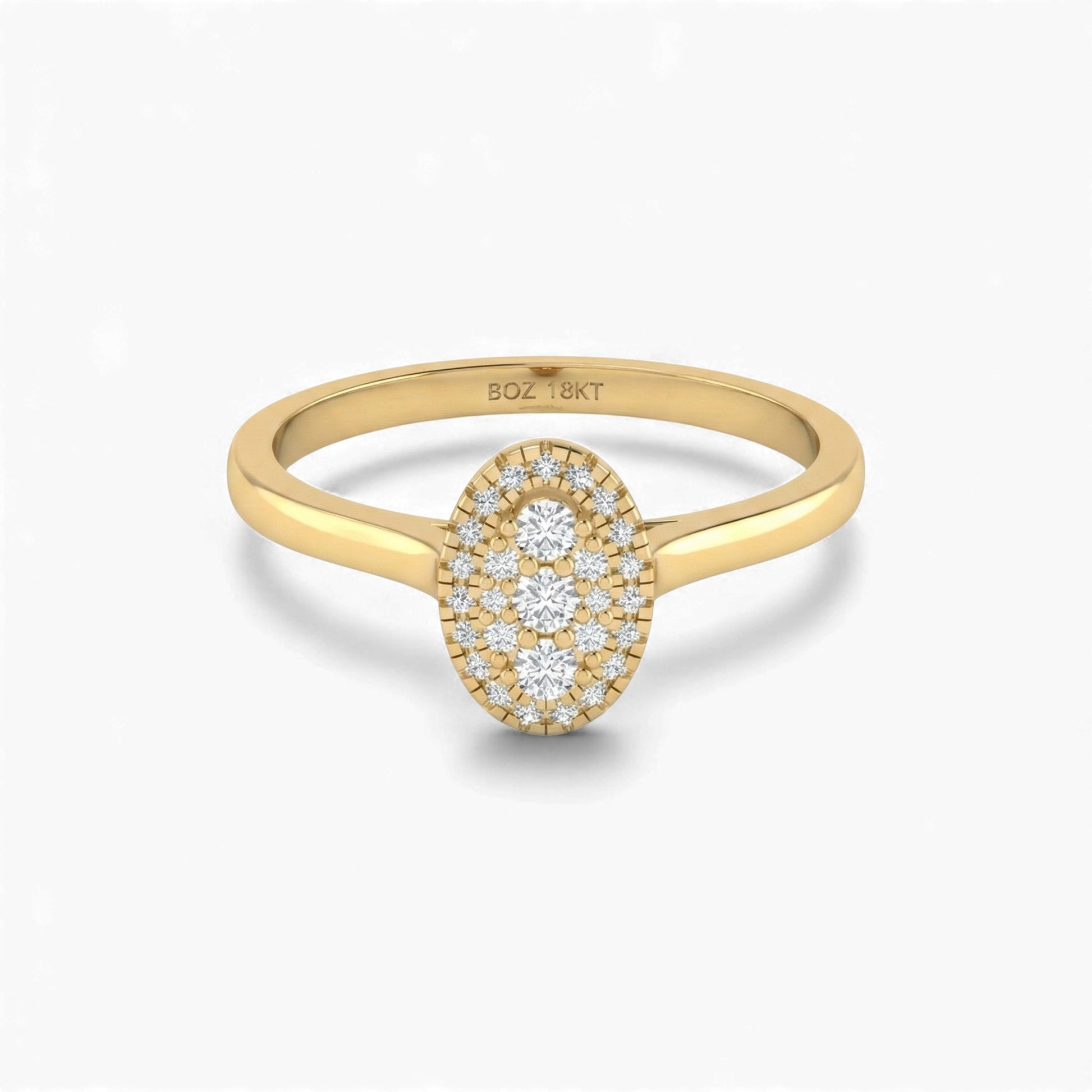 Gold ring with diamond oval design on a white background