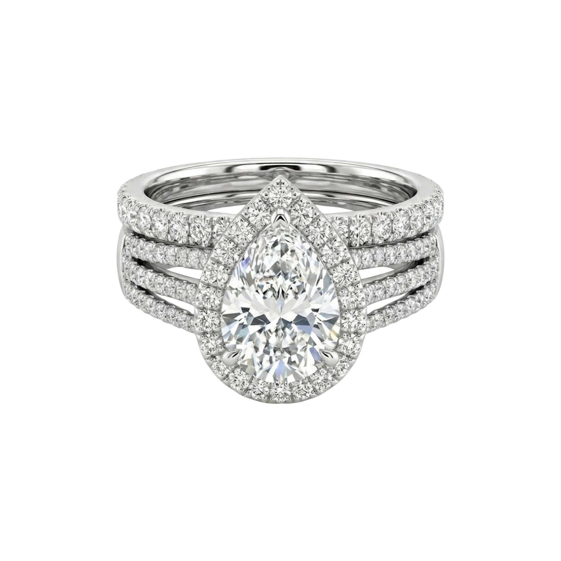 Diamond ring with a pear-shaped center stone on a white background