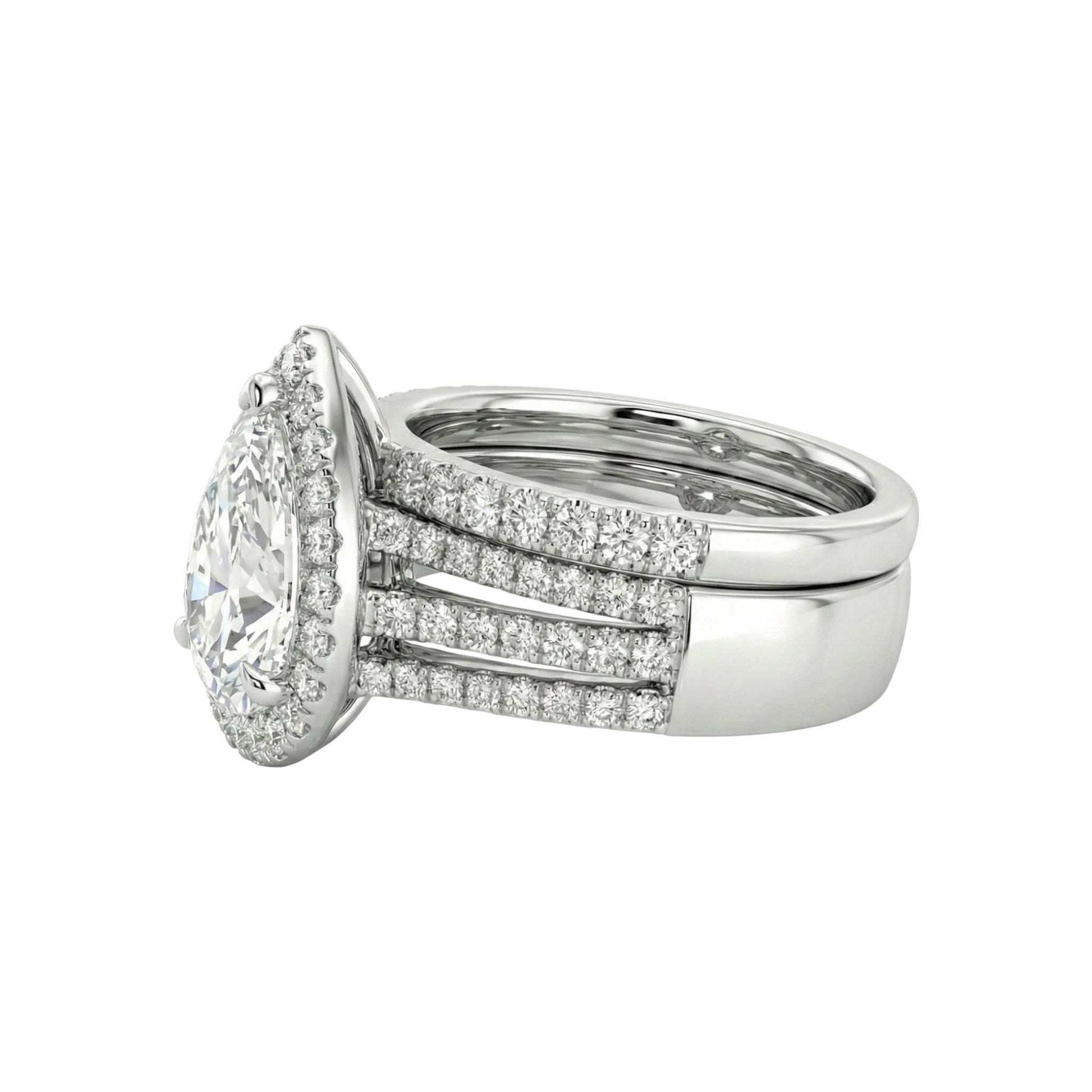 Diamond ring with a halo and side stones on a white background