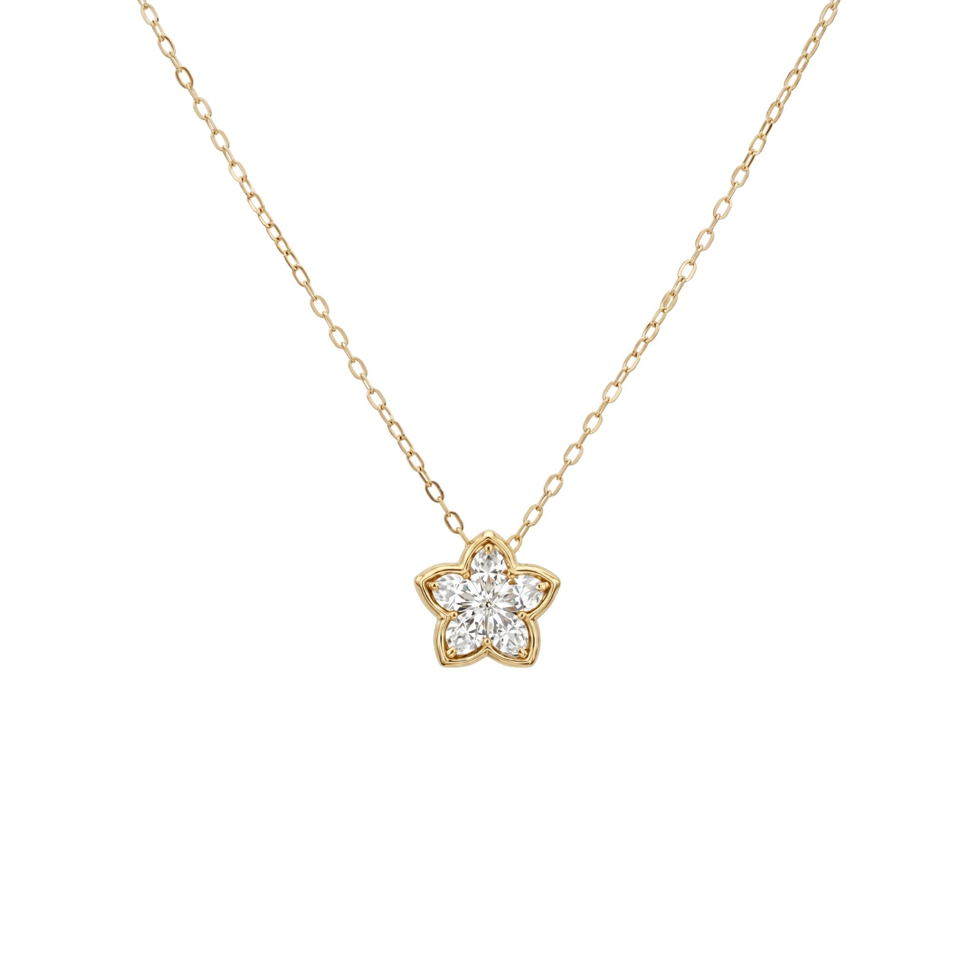 Gold necklace with a star-shaped diamond pendant on a white background