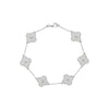 Silver bracelet with floral designs on a white background