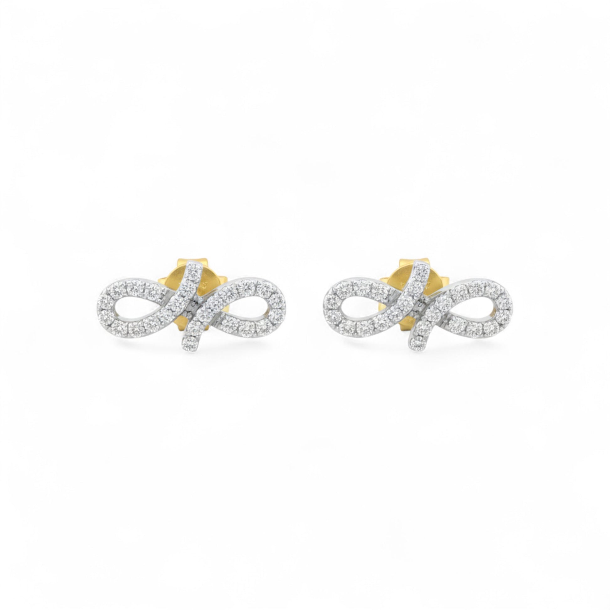 Pair of gold and silver infinity symbol earrings on a white background