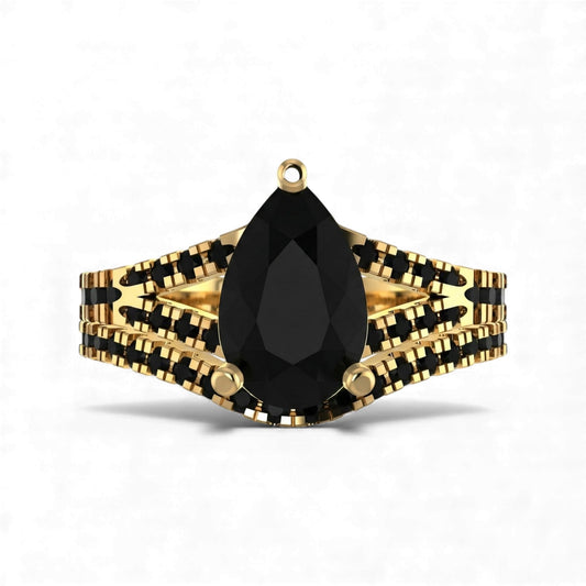 Gold and black jewelry piece with a teardrop-shaped black gemstone on a white background