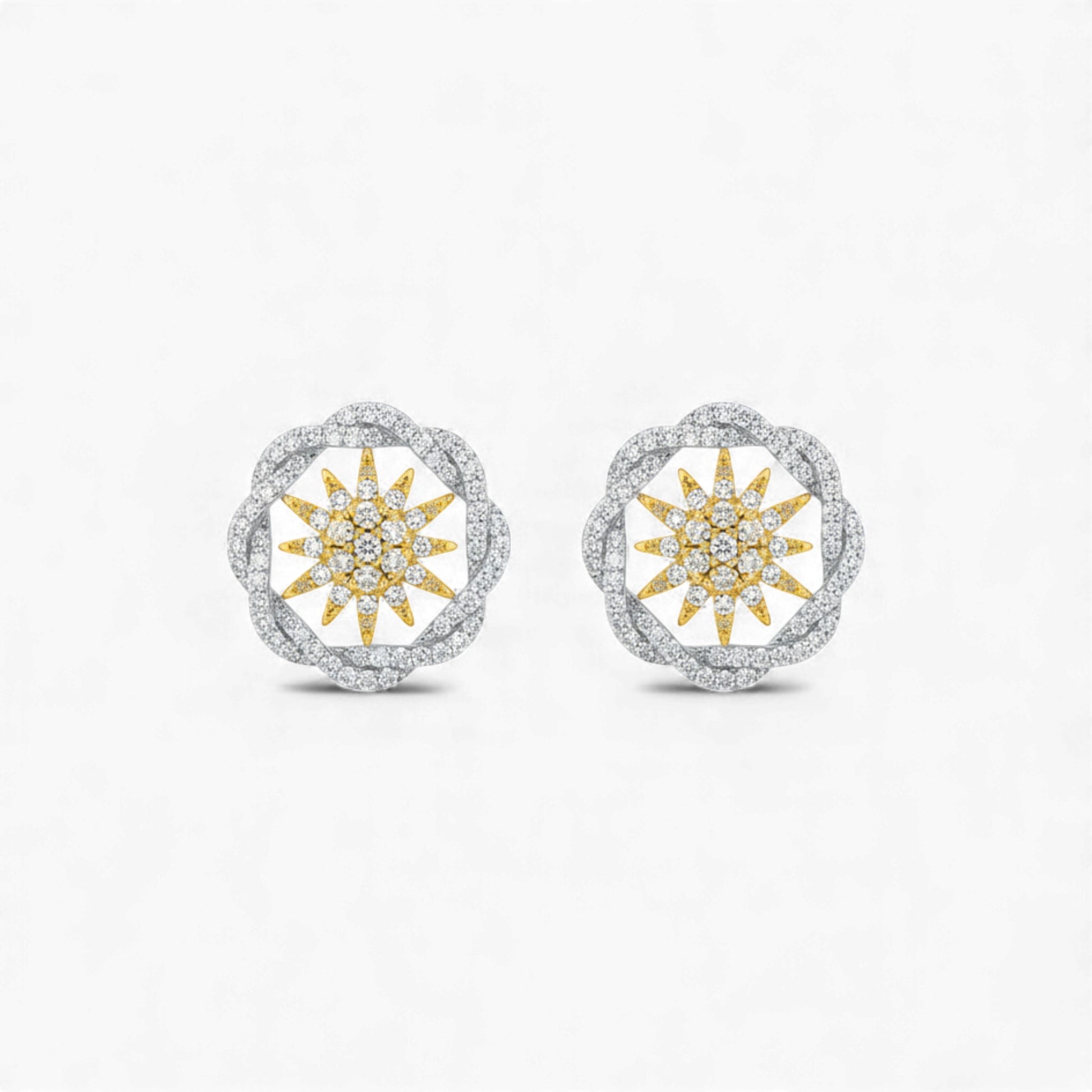 Pair of earrings with sunflower design on a white background