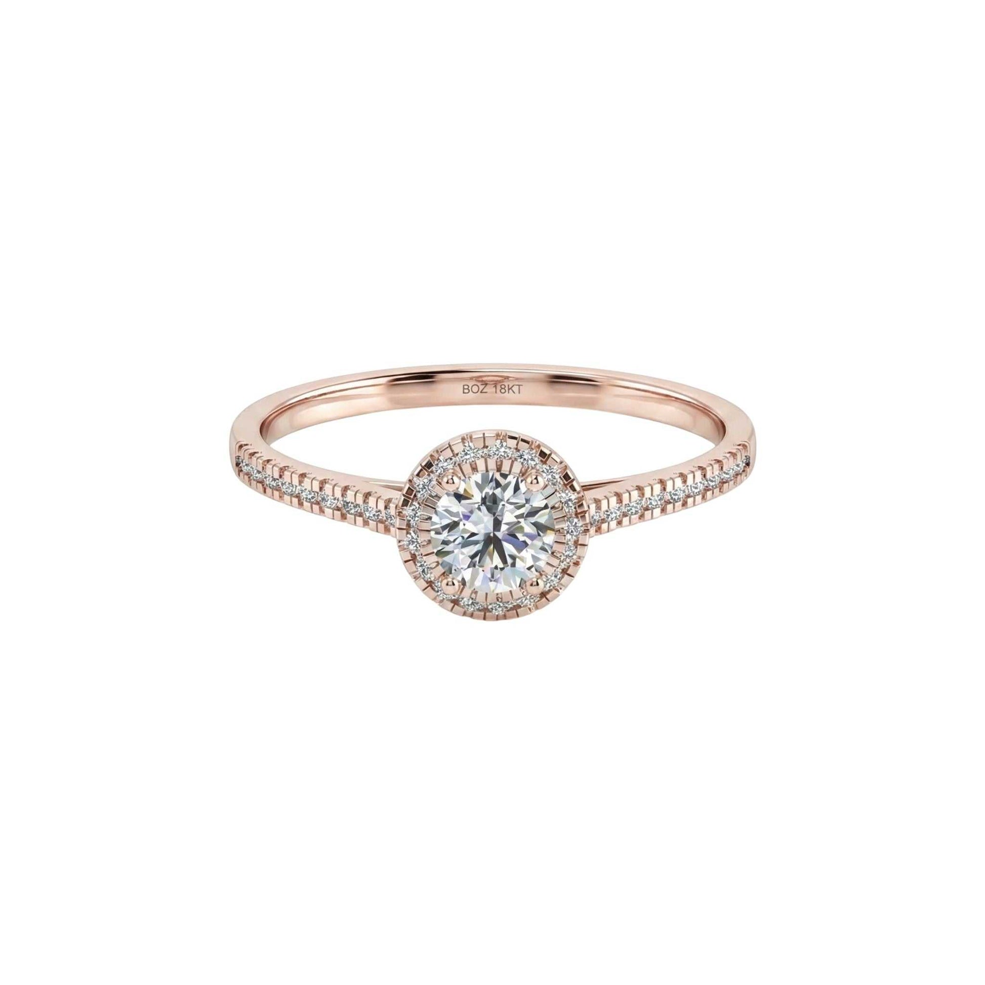 Rose gold ring with a diamond on a white background