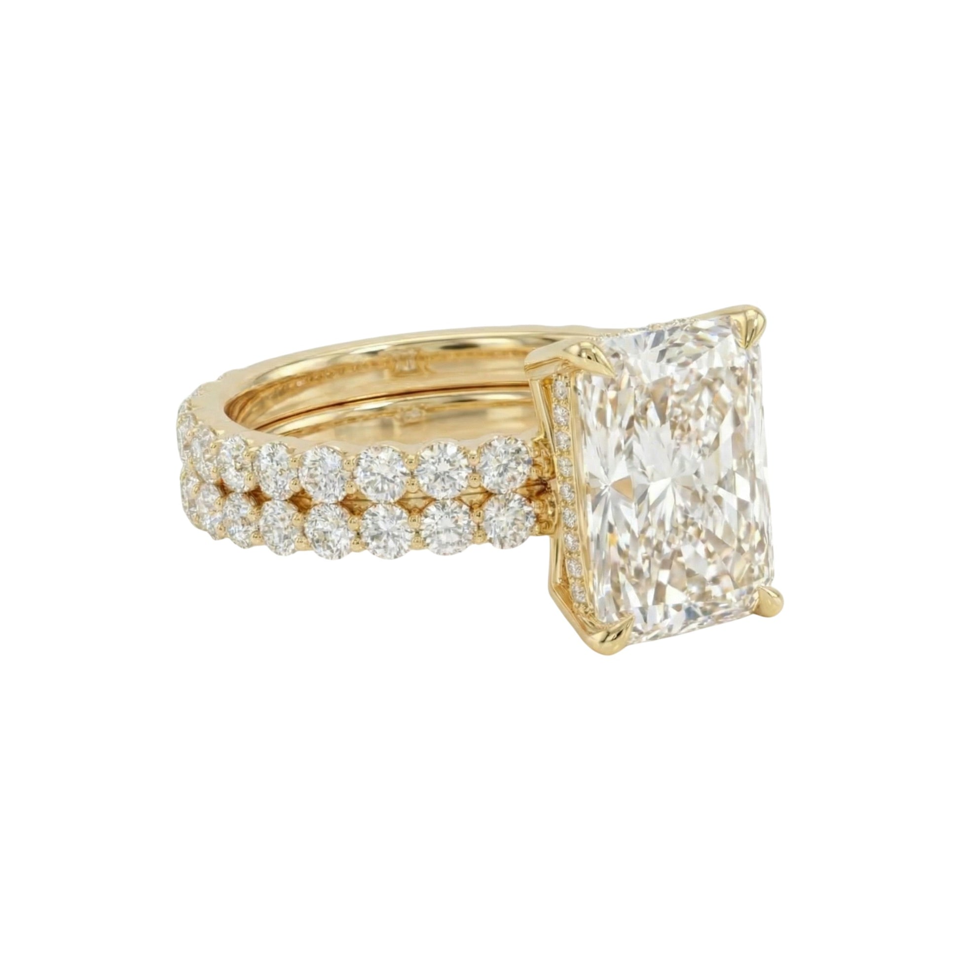 Gold ring with a large diamond and smaller diamonds on a white background