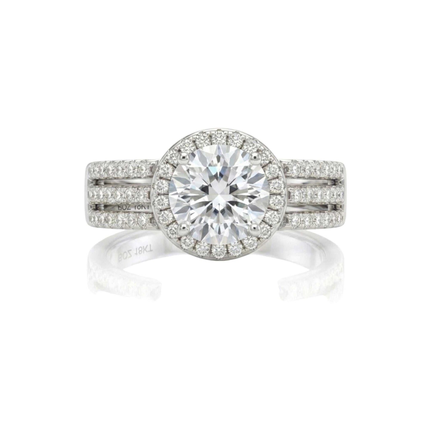 Triple shank sterling silver engagement ring with round cut cubic zirconia and double halo pavé design