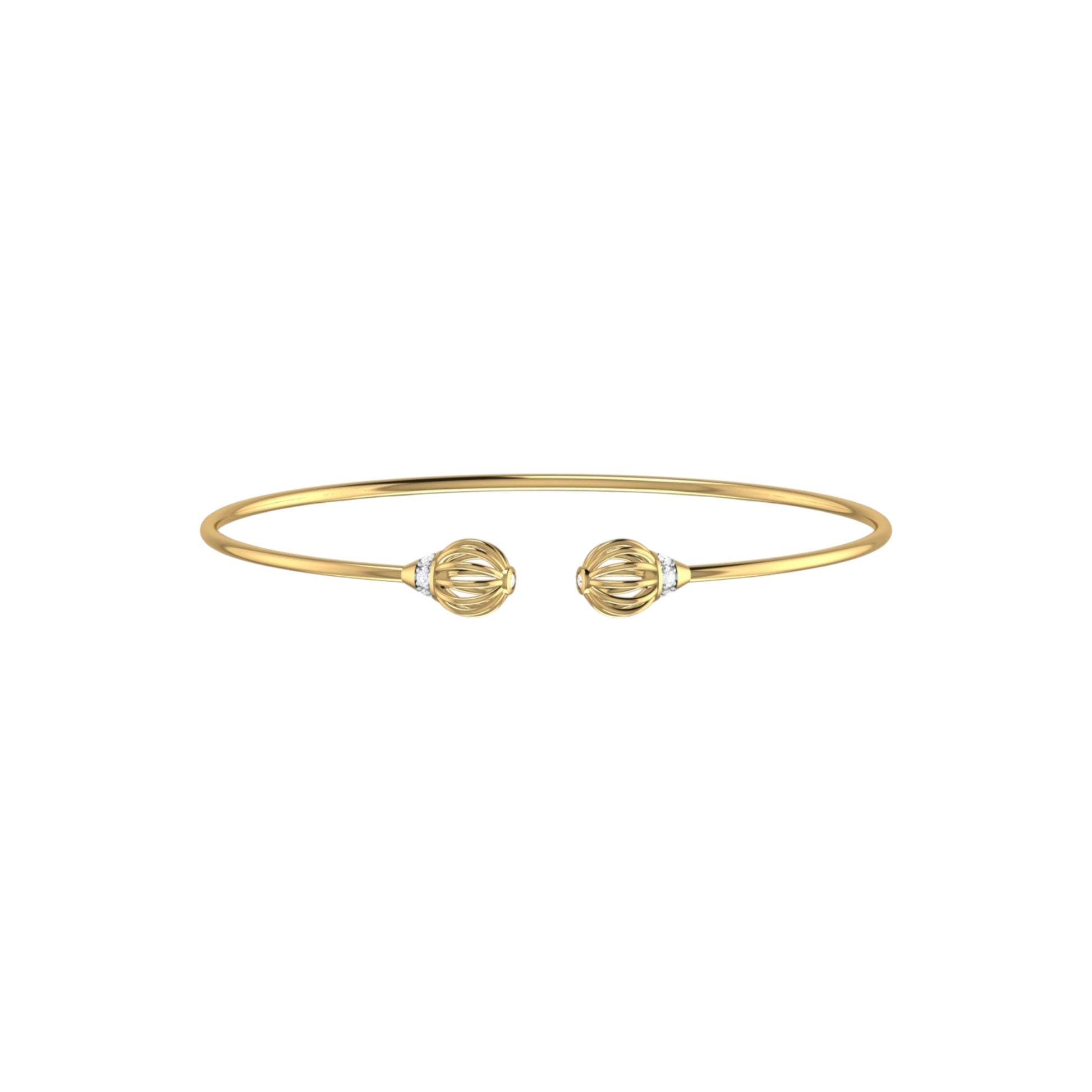Gold bracelet with two decorative elements on a white background