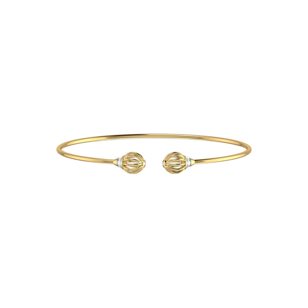 Gold bracelet with two decorative elements on a white background