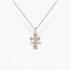 Rose gold cross necklace on a white background