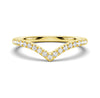 A gold band ring with a curved design and set with moissanite gemstones.