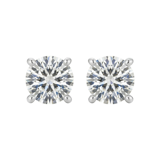 Pair of round diamond stud earrings on a white background