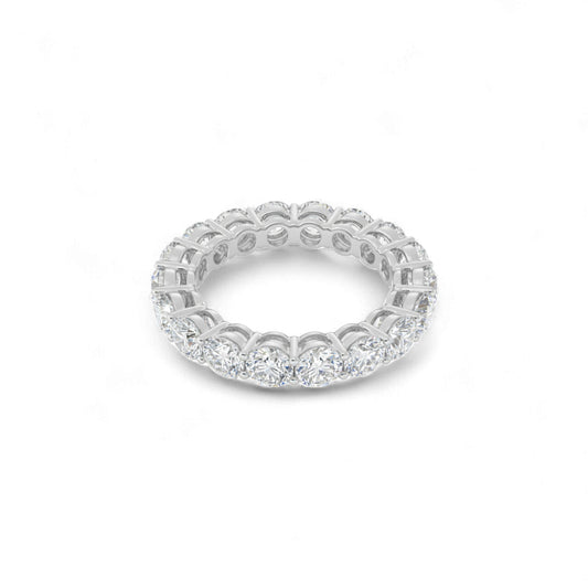 Silver ring with diamond accents on a white background
