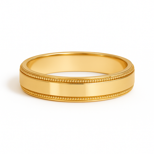 Gold ring with milgrain detailing on a white background