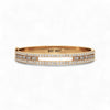 Gold bracelet with diamonds on a white background