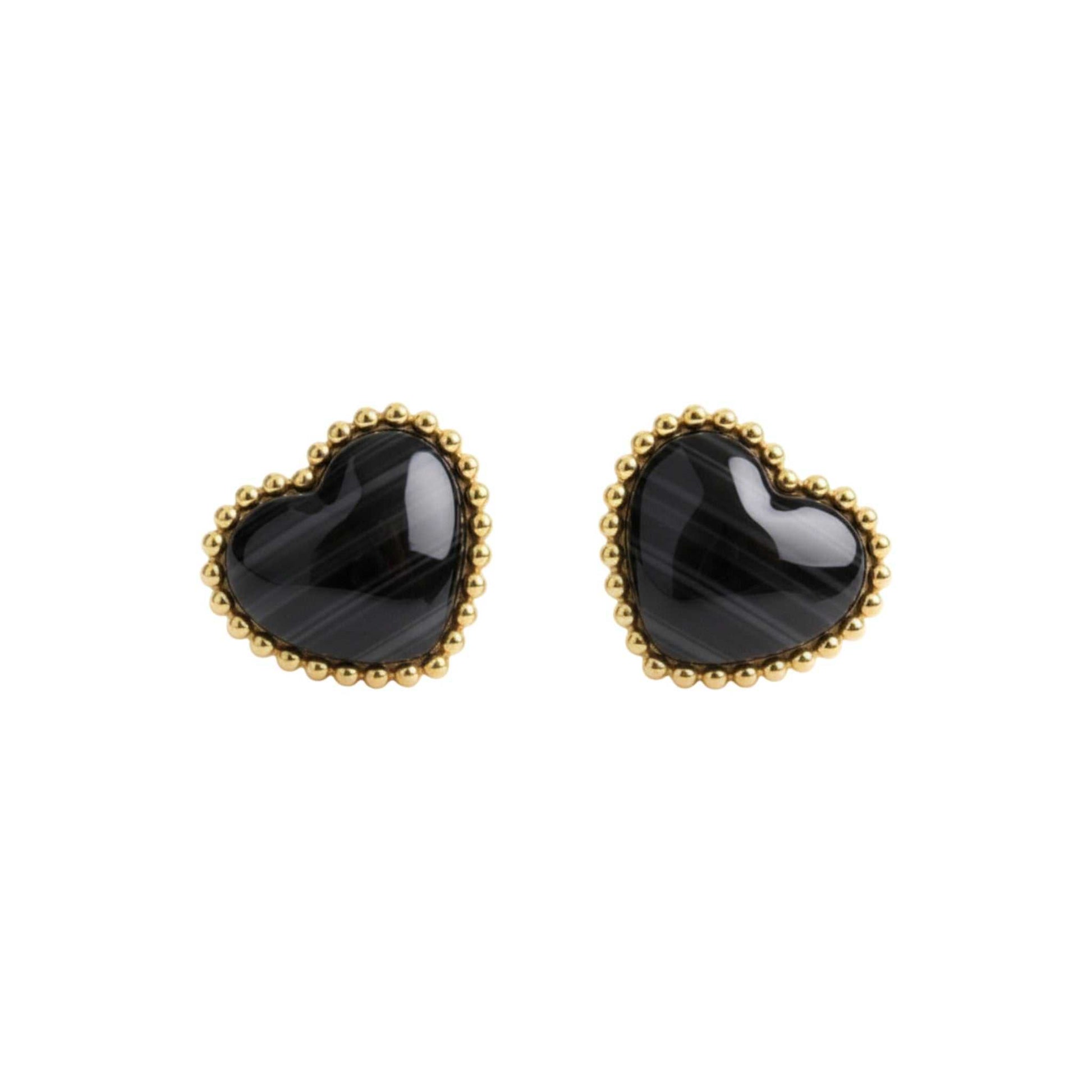 Heart-shaped black earrings with gold rims on a white background