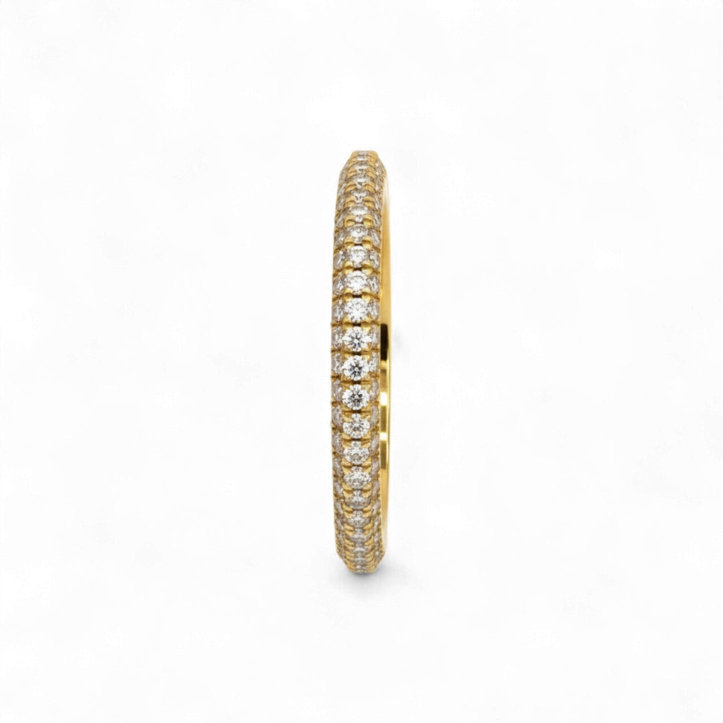 Gold ring with diamond accents on a white background