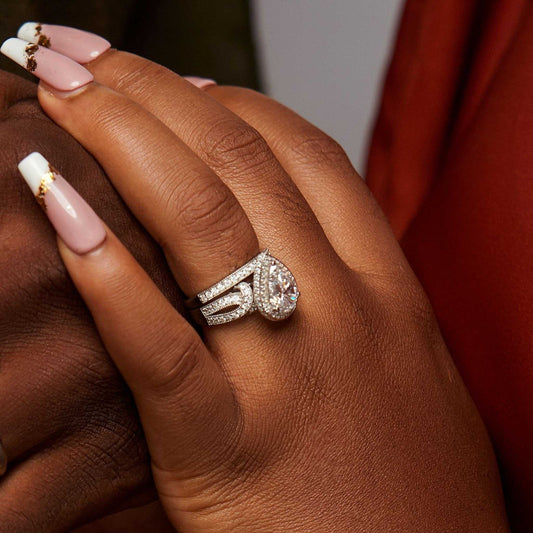 Bliss Pear Cut CZ Bride Set sterling silver pear-cut cubic zirconia engagement ring with contoured band and CZ accents on hand