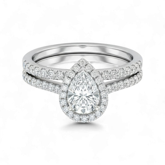 Diamond ring with pear-shaped center stone on a white background