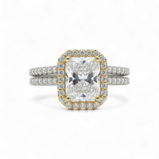 Diamond ring with gold and silver band on a white background