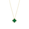 Gold necklace with a green clover pendant on a white background