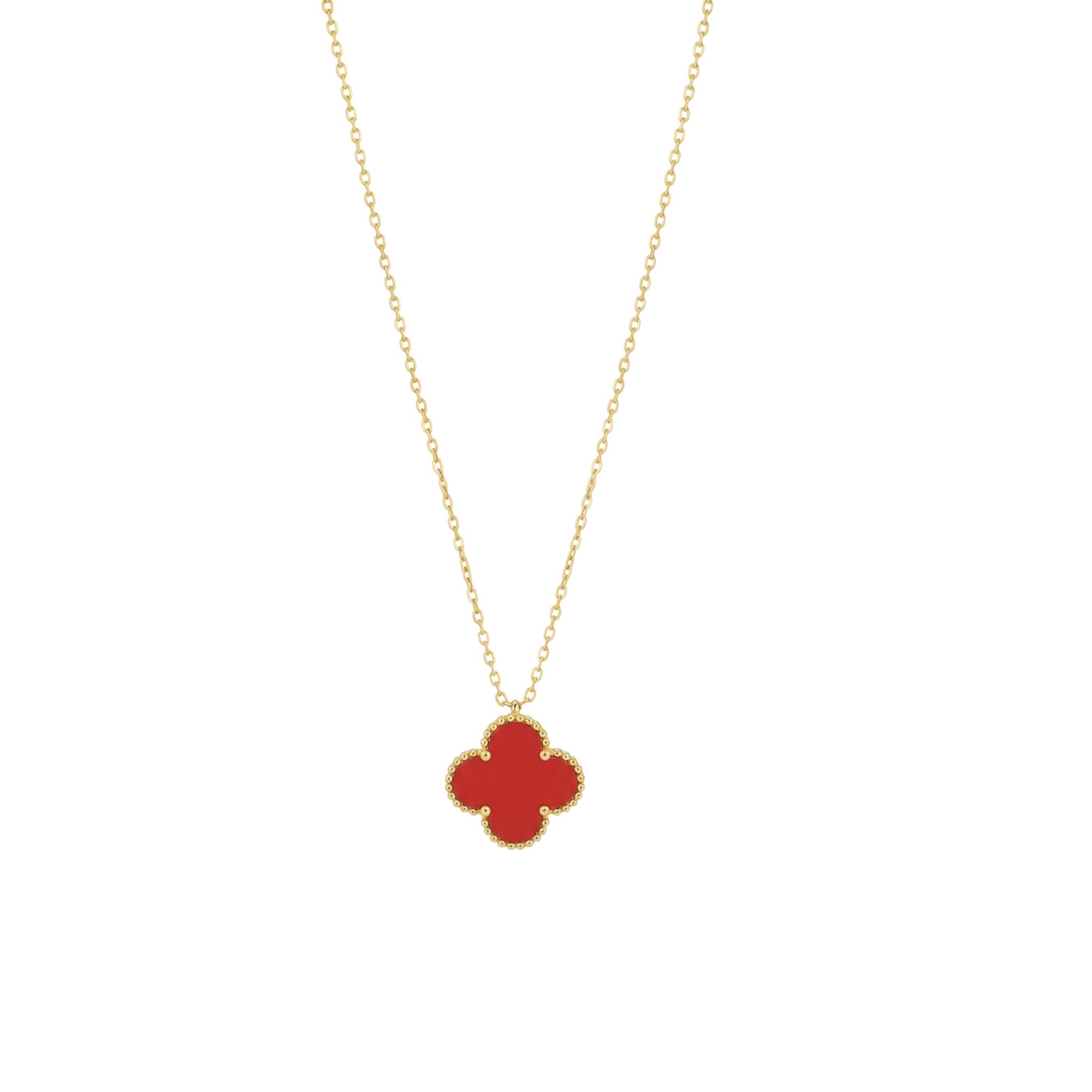 Gold necklace with a red clover pendant on a white background