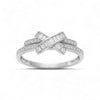 Silver ring with diamond accents on a white background