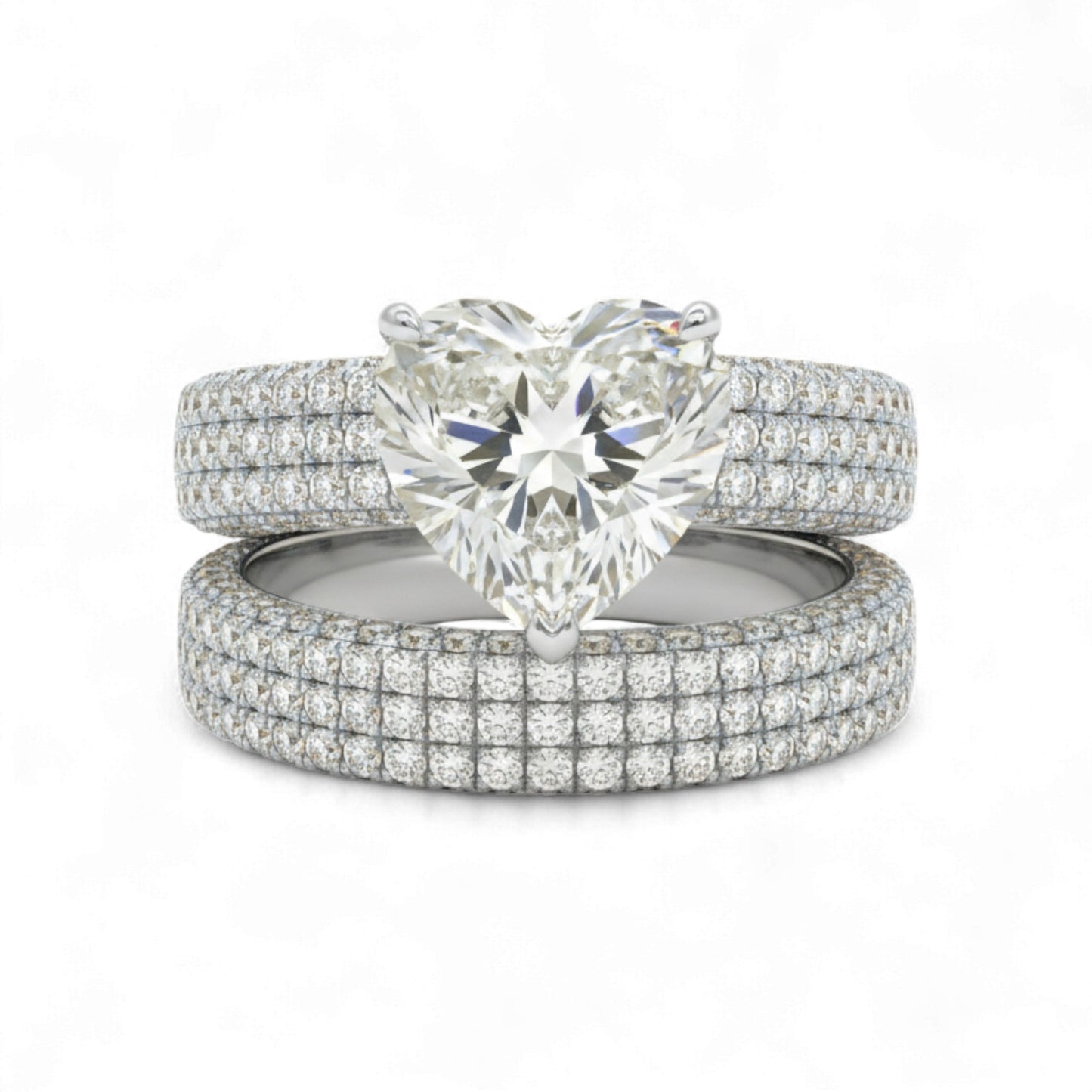 Set of diamond rings with a heart-shaped center stone on a white background