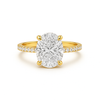 Gold ring with a large diamond and smaller diamonds on the band against a white background