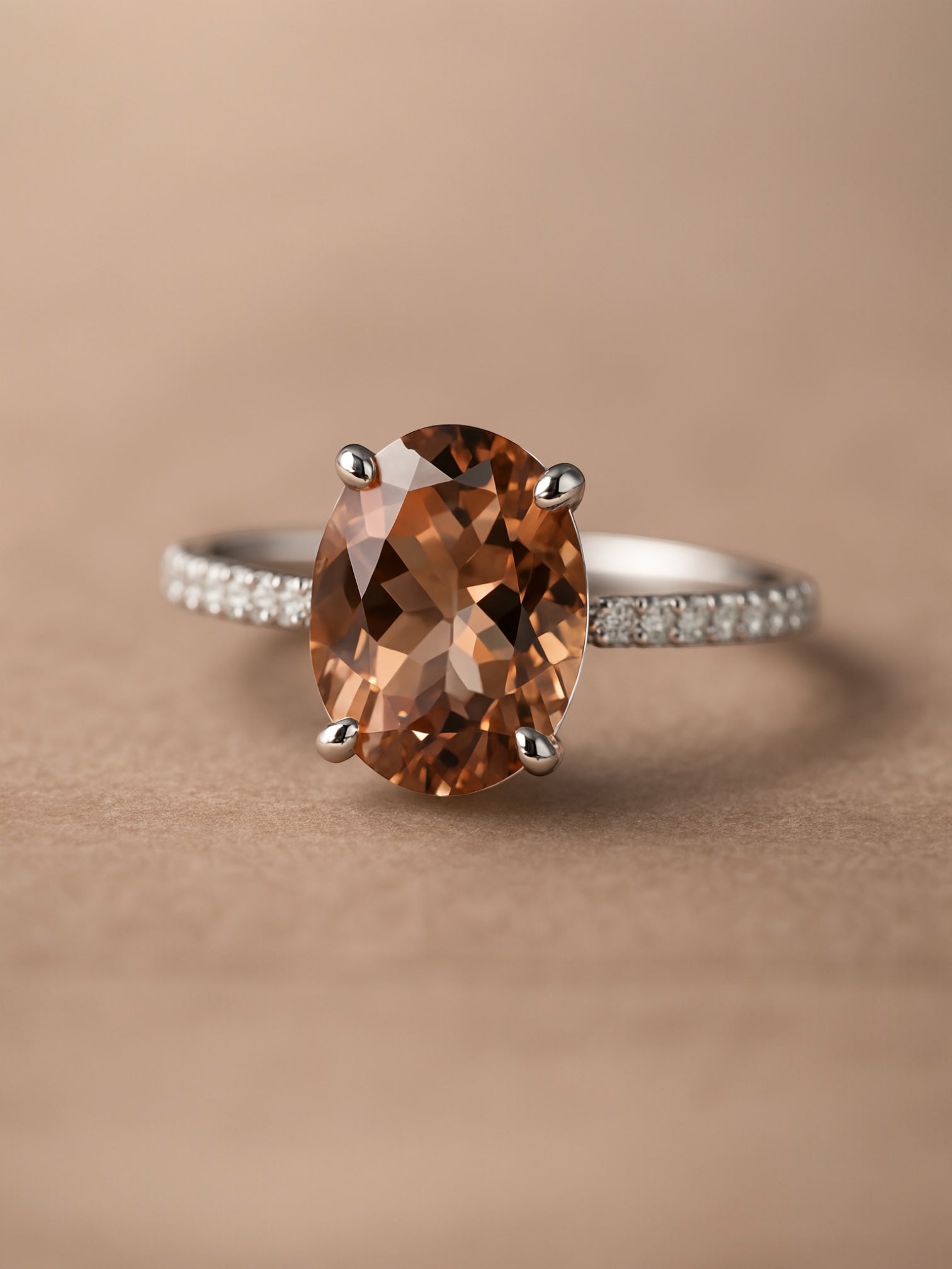 Ring with a brown gemstone on a beige background