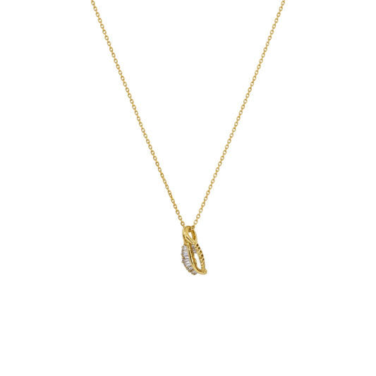 Gold necklace with a small pendant on a white background
